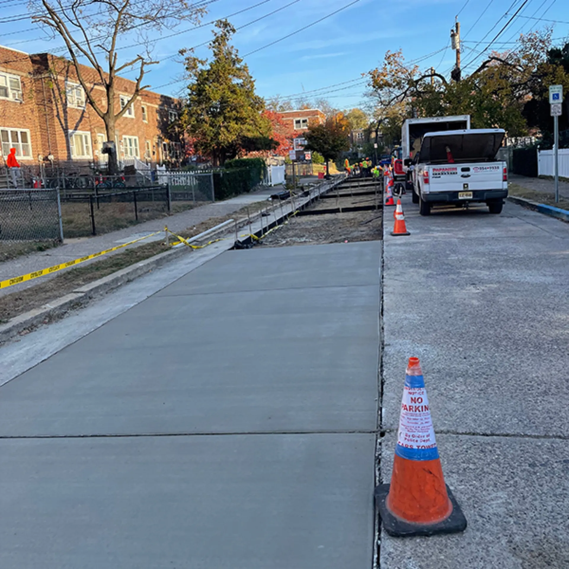 Wide commercial concrete sidewalk fresh pour curing in place Cherry Hill NJ