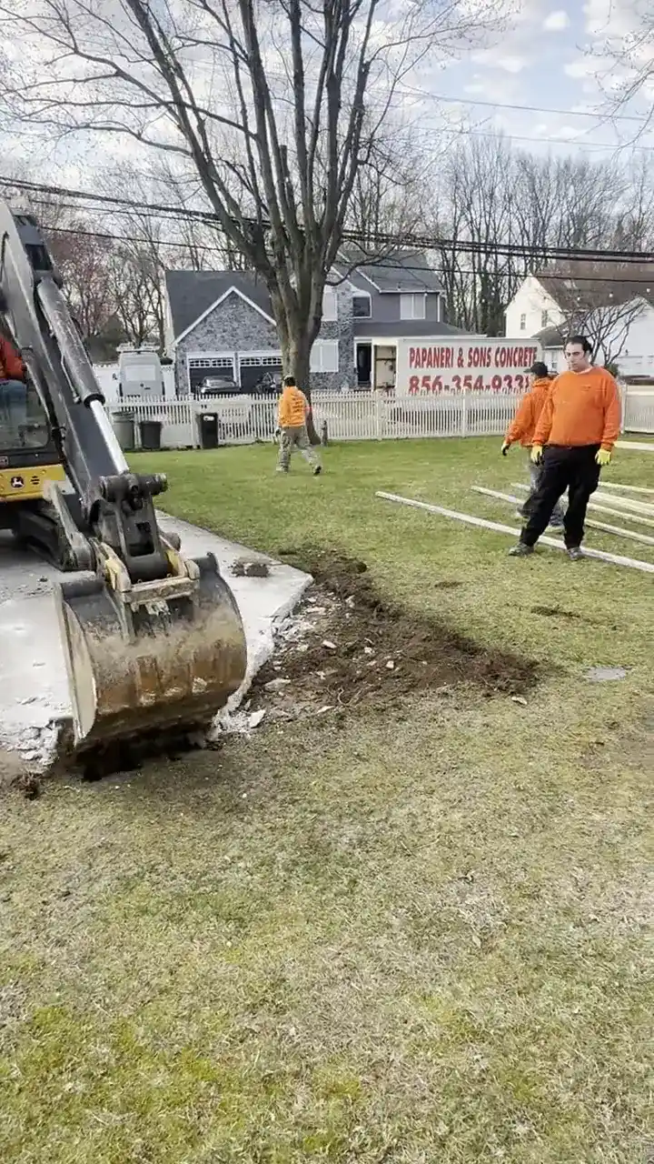Papaneri excavator digging out broken concrete on a Cherry Hill, NJ job site