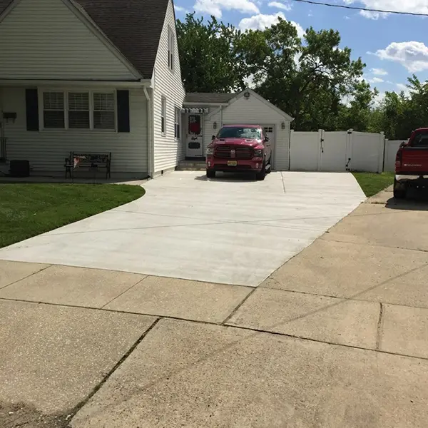 Completed concrete driveway installed at residential home Cherry Hill NJ