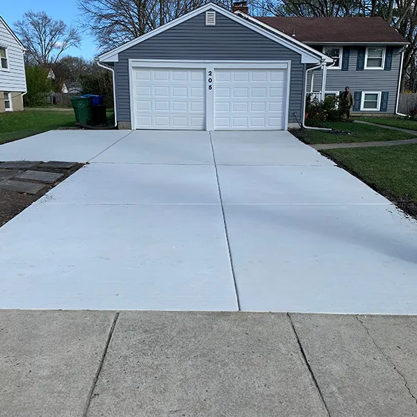 Concrete driveway installed at home with two-car garage Cherry Hill NJ