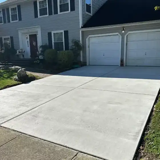 Finished concrete driveway at a colonial home in a Cherry Hill, South Jersey neighborhood