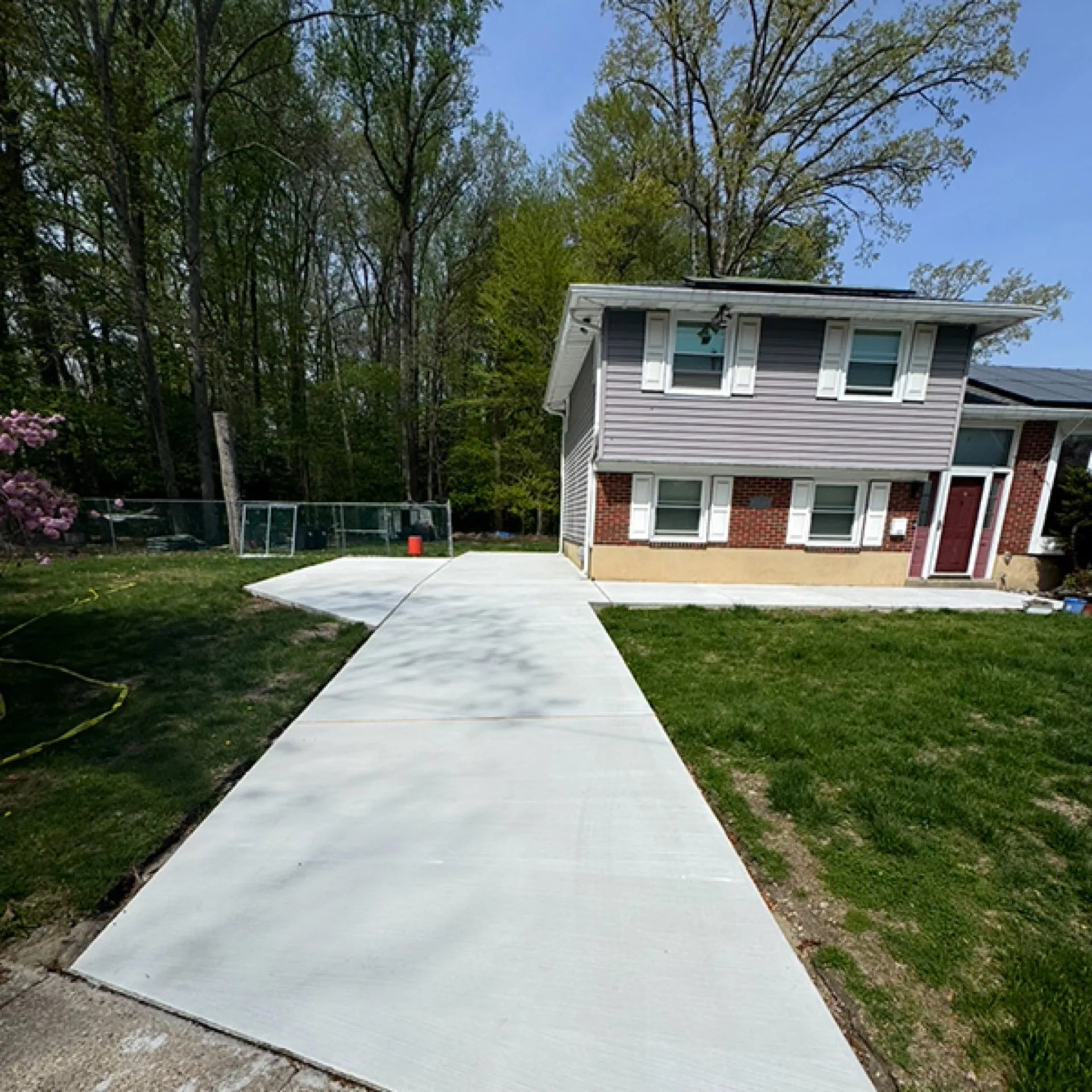 New concrete driveway at split-level home with walkway Cherry Hill NJ