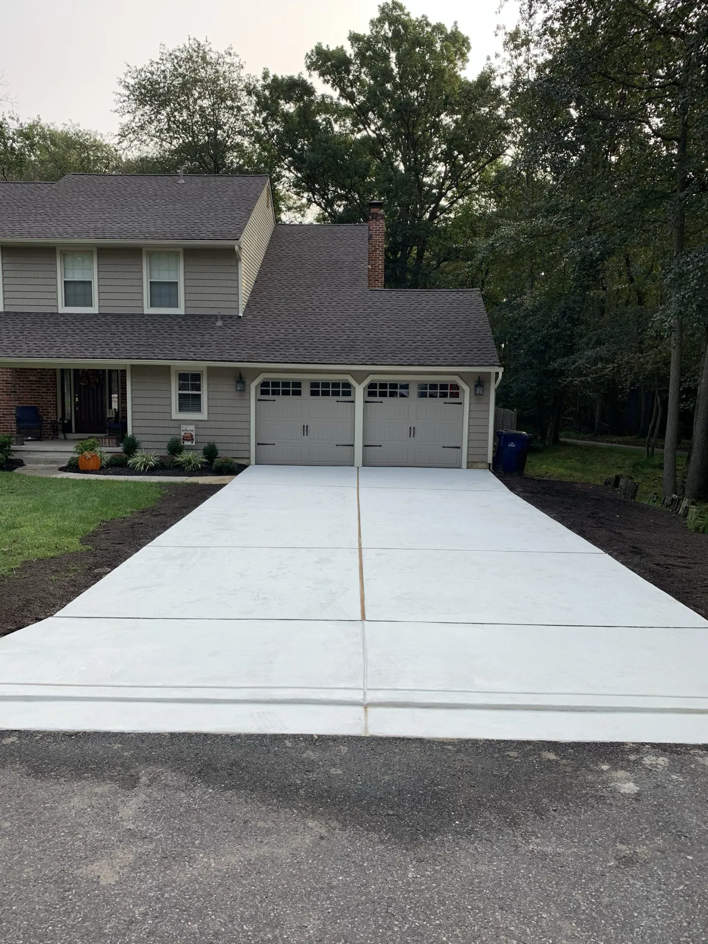 Wide double-car concrete driveway freshly installed Cherry Hill NJ