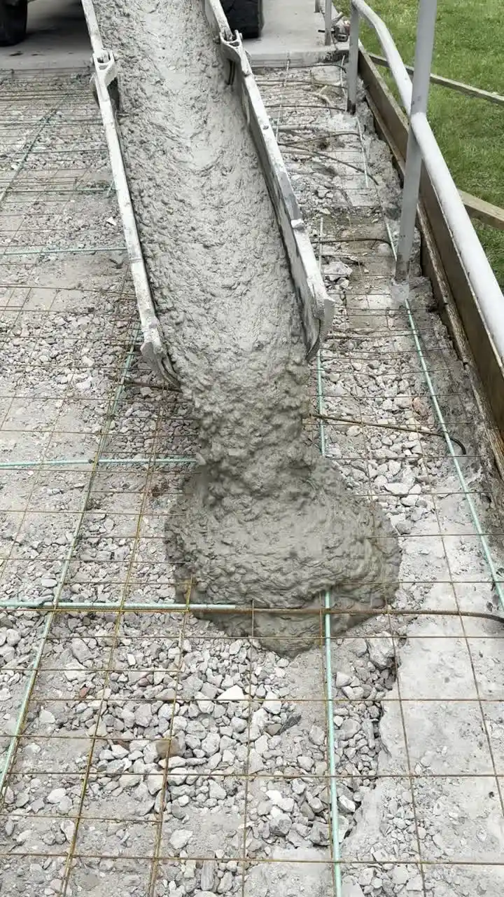 Wet concrete placed over a steel rebar mat at a Cherry Hill, NJ structural pour
