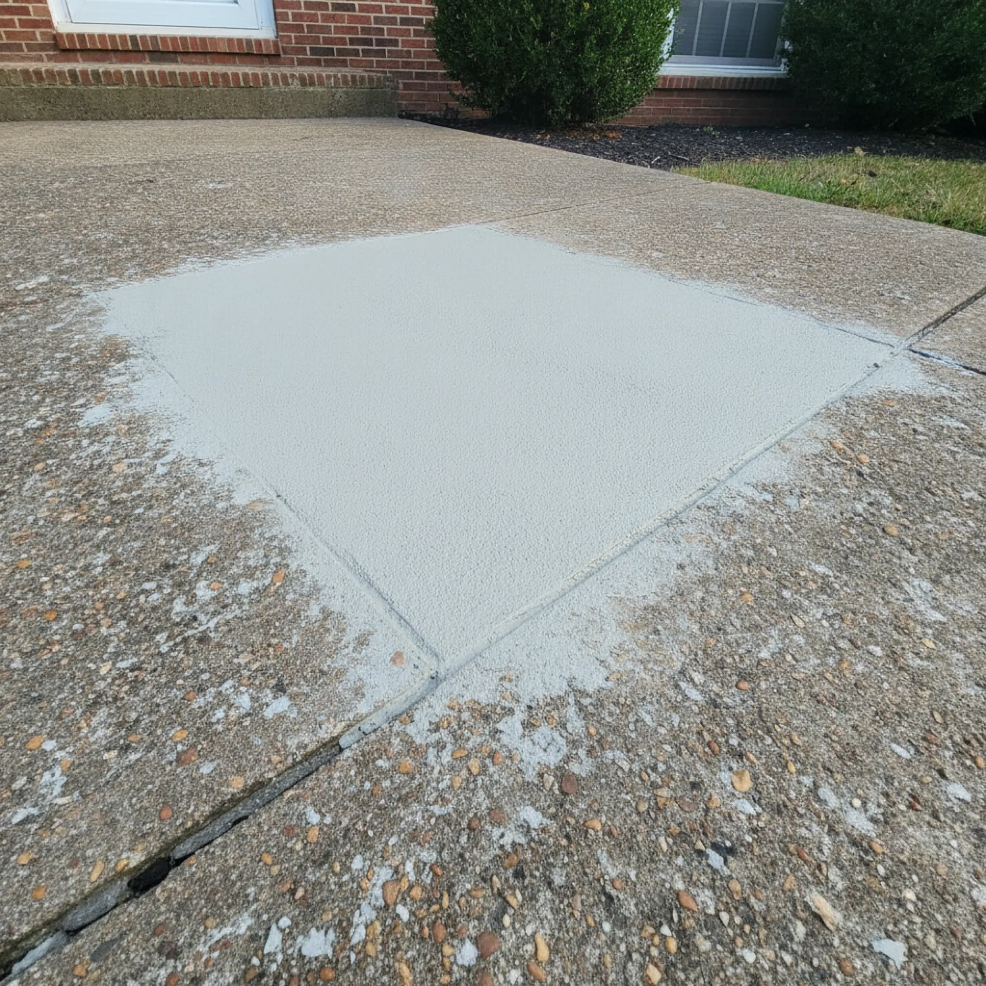 Spalled concrete area patched during a Cherry Hill, NJ repair by Papaneri & Sons