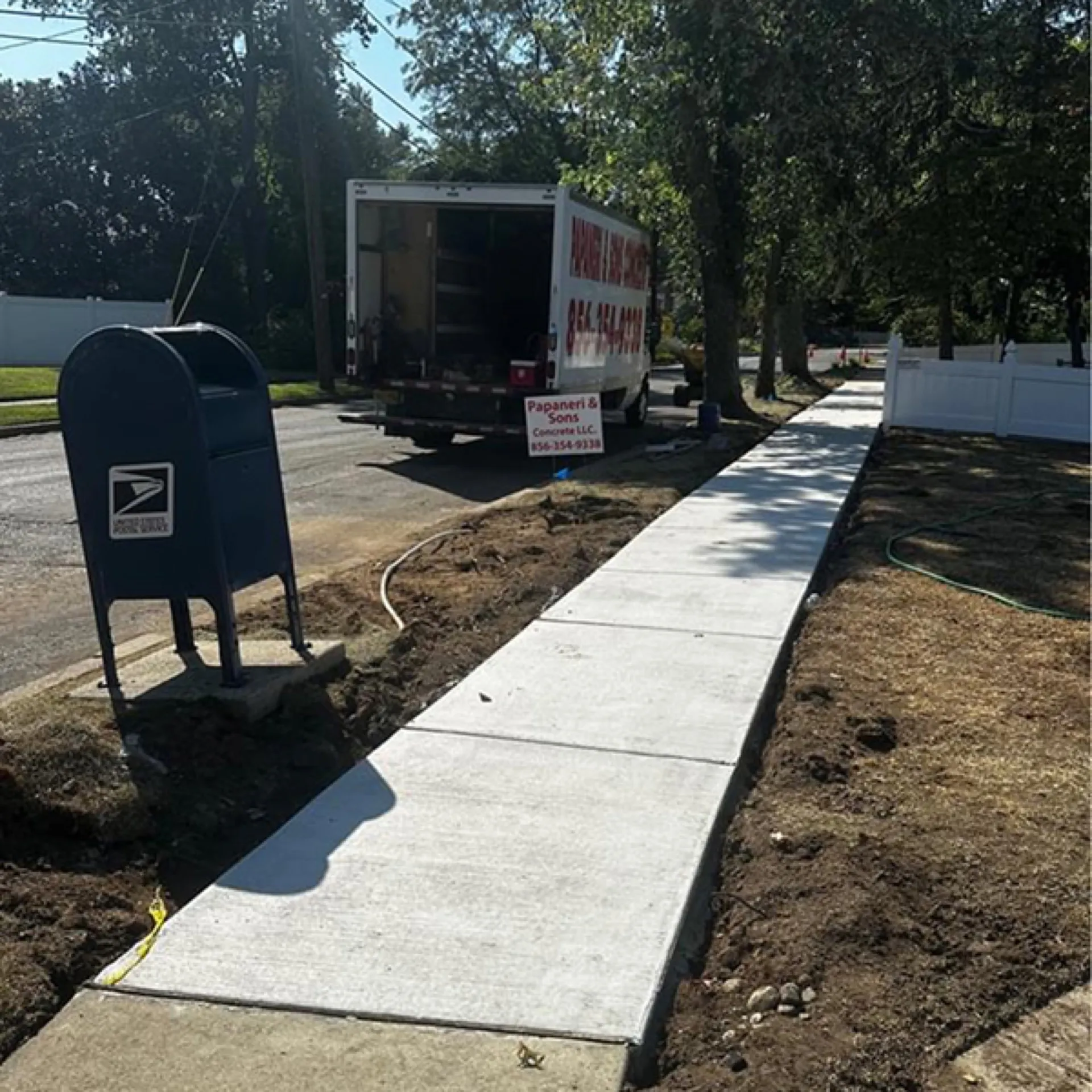 New concrete sidewalk installation with Papaneri truck on site Cherry Hill NJ