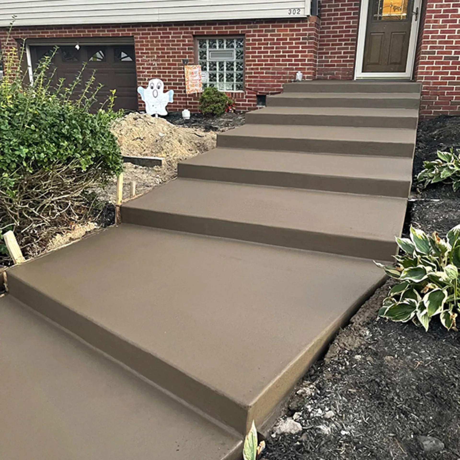 Colored concrete steps with smooth finish at brick home Cherry Hill NJ