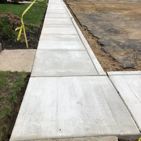 Concrete sidewalk replacement installed along residential property Cherry Hill NJ